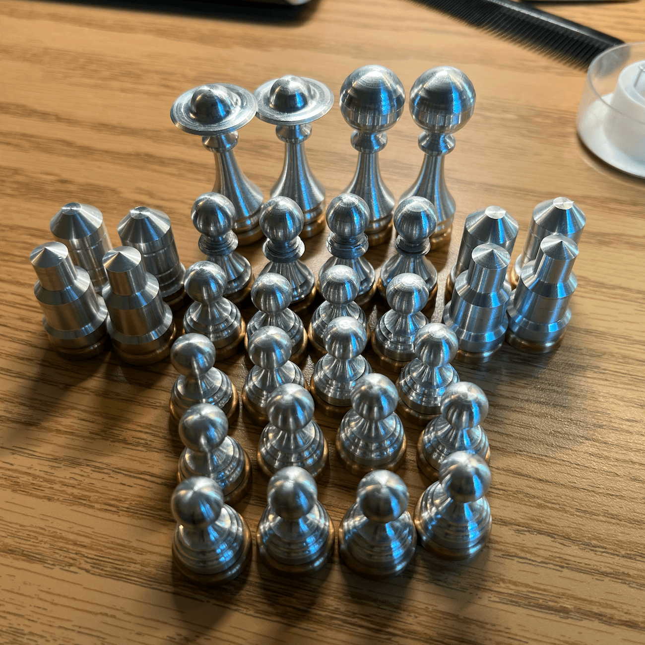 Space Chess pieces after deburring and assembly